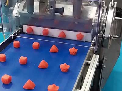 The discharged material is evenly cut into portions by the flow cutter